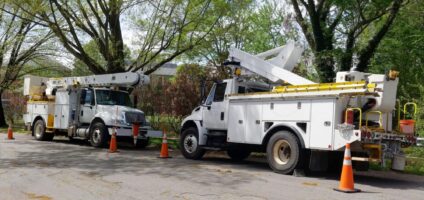 utility trucks parked on a street